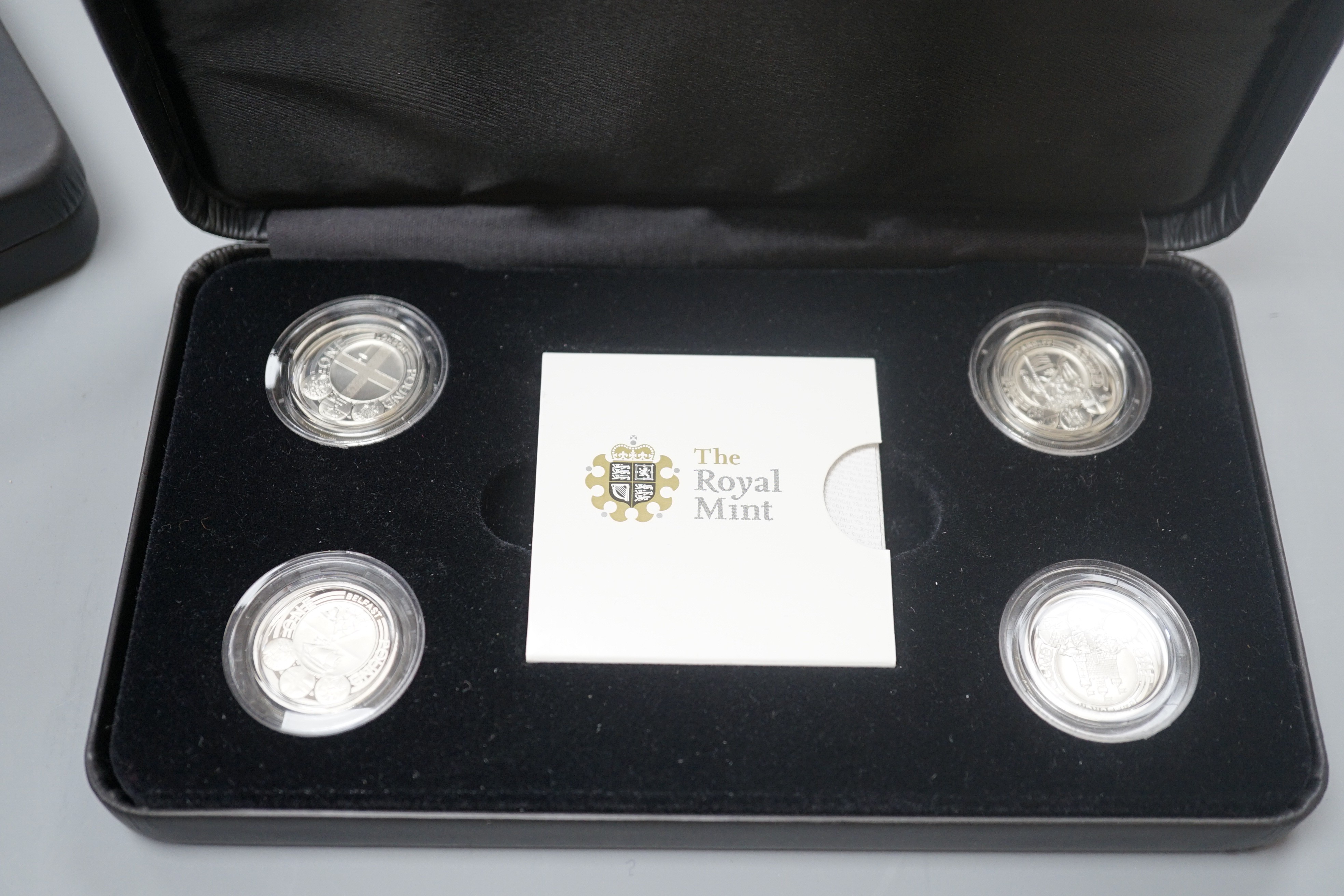 A cased Royal Mint UK Piedfort collection of silver proof coins 2007 and a cased set of four silver proof £1 coins, 2010/11